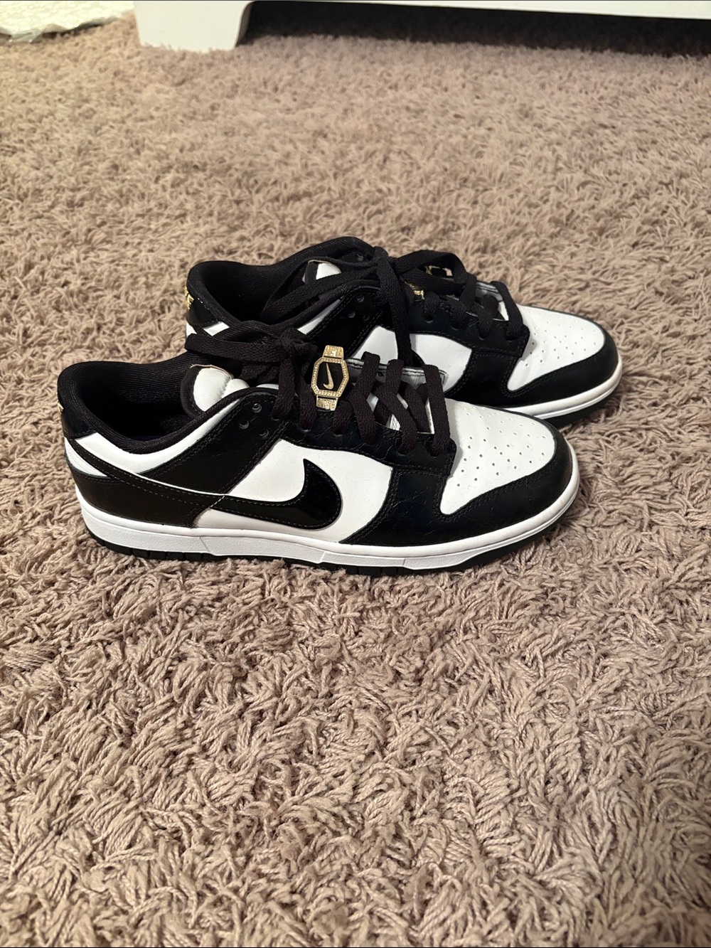 Nike Kids Black and White Low-Top Sneakers with Gold Accent